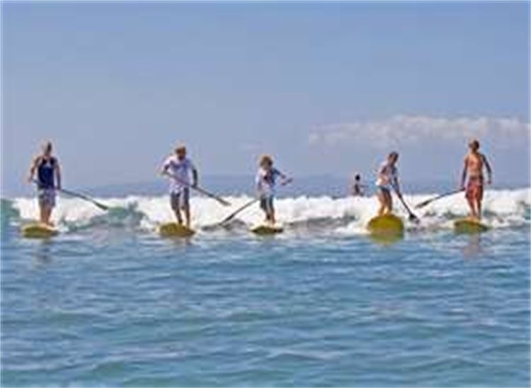 Group of people on Stand Up Paddleboards